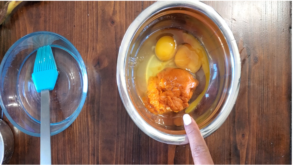 Stainless steel bowl with puree and eggs