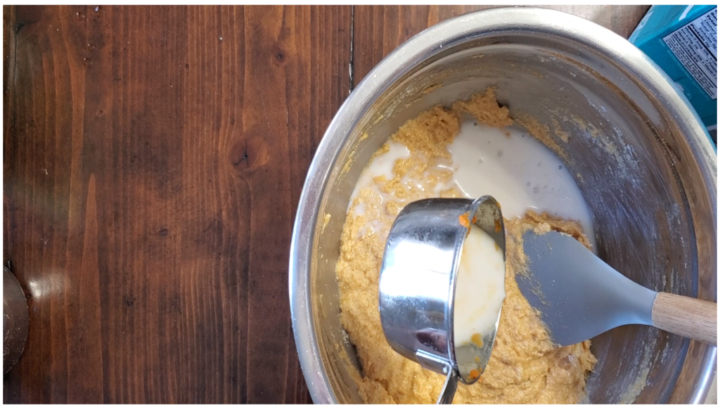 Milk being added to ingredient mixture