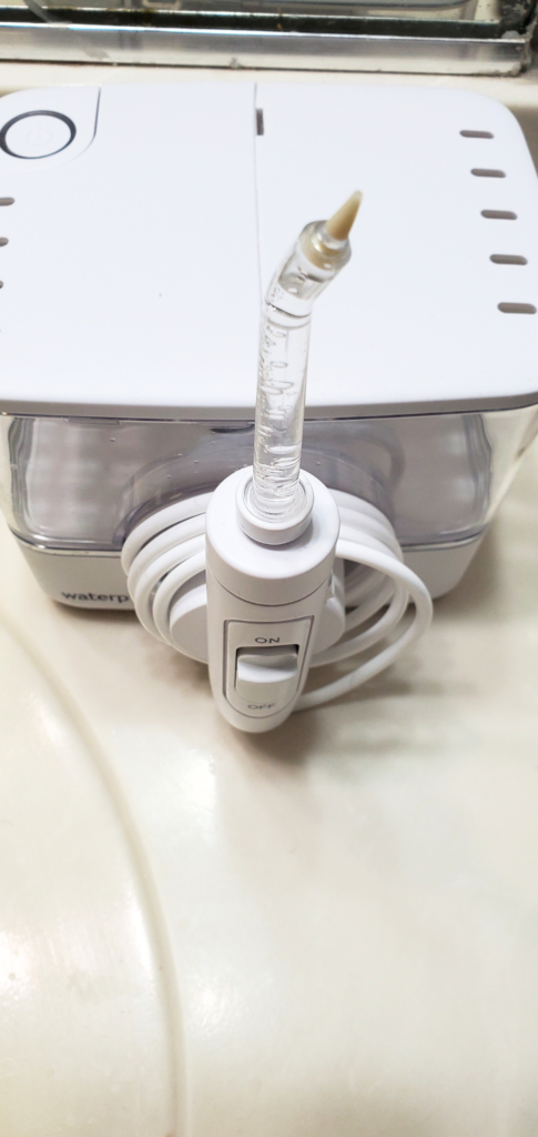 waterpik machine with water in the reservoir