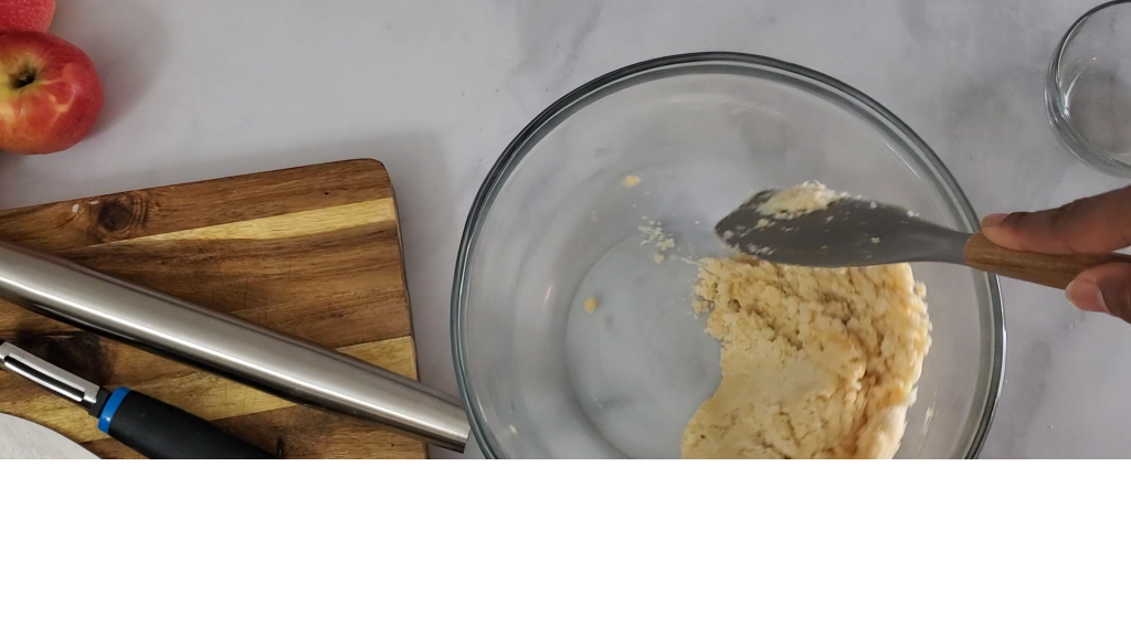 Mixture of pie dough coming together