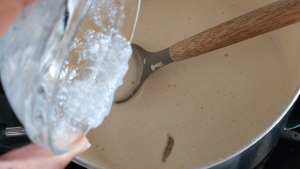 xanthan gum mixture being added to dairy free ice cream mixture