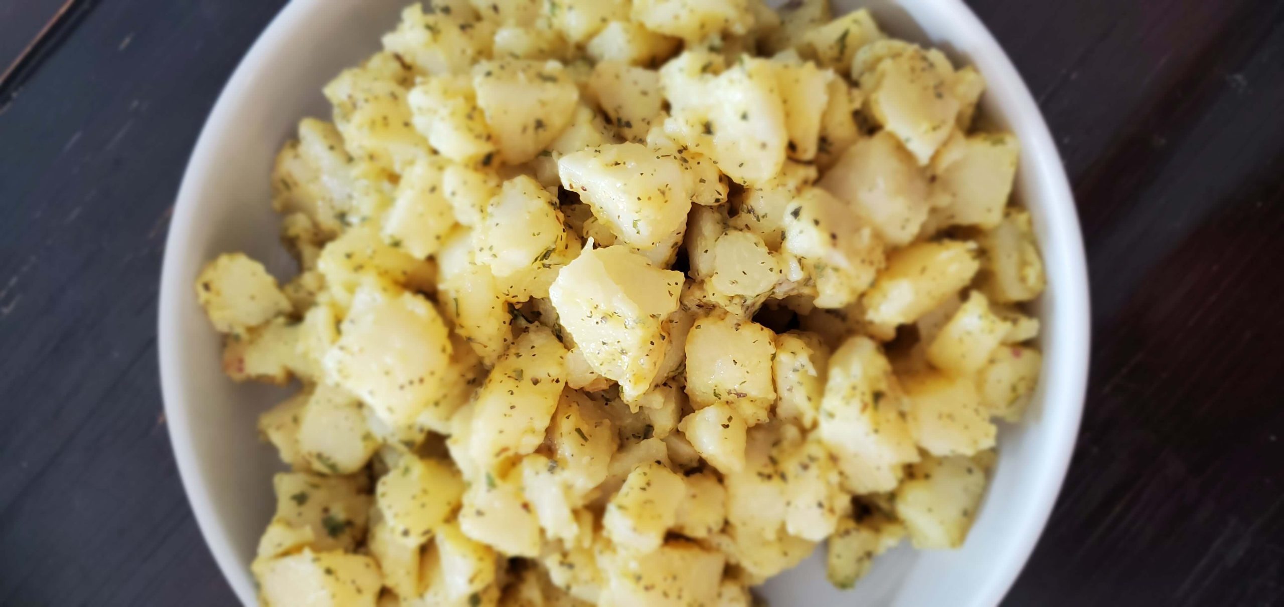 white bowl filled potato salad