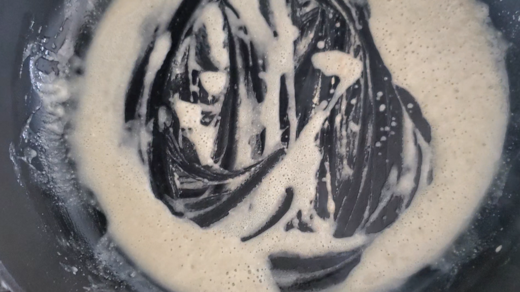 cast iron pan with a gravy roux mixture