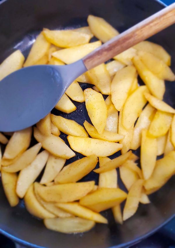Large skillet with sliced apples