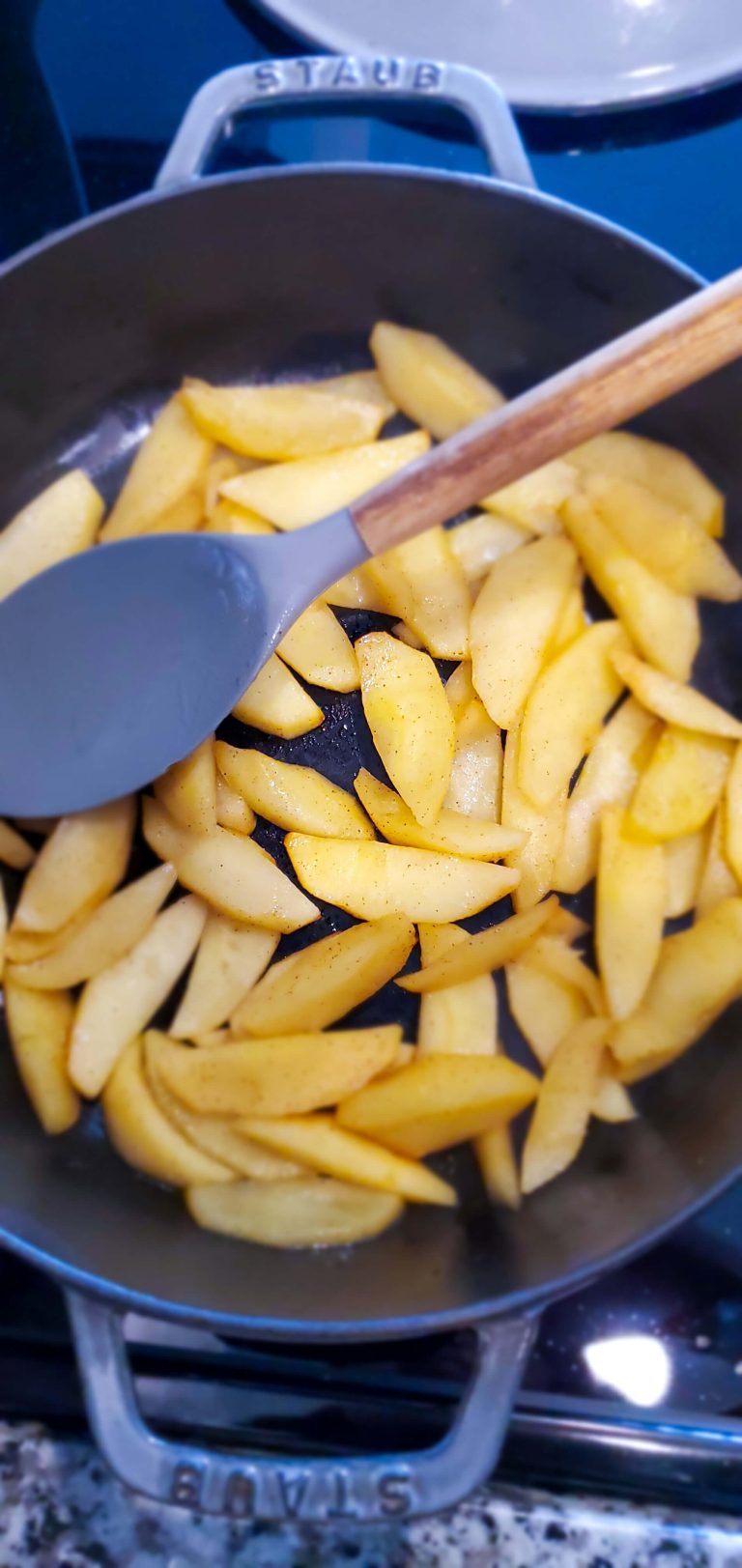 Large skillet with sliced apples