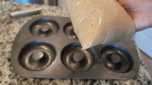 Gluten free doughnut batter in a plastic zip top bag